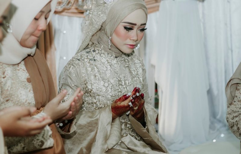 bride wearing beige abaya dress and tiara